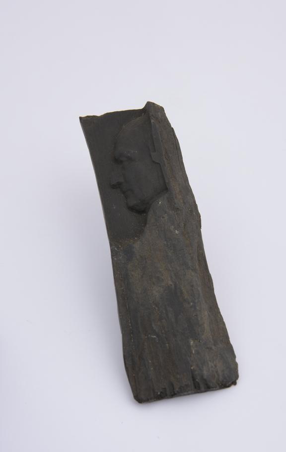 1 Reproduction on piece of ebony, 4 1/8 x 1 1/4''