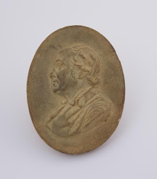Composite cast, male profile bust