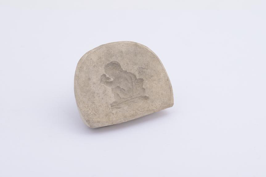 1 Plaster mould, child nude seated, smelling flower