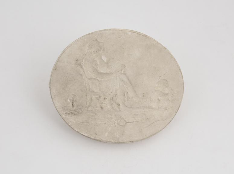 1 Plaster mould, woman on chair reading