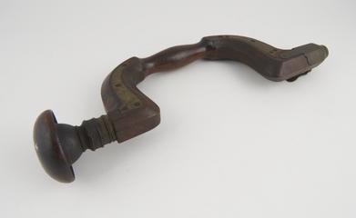 Brass bound brace with spring key-latch