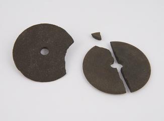 Two emery composition lathe operated grinding wheels