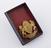 Gilt lapel badge in form of coat of arms supported by lion and