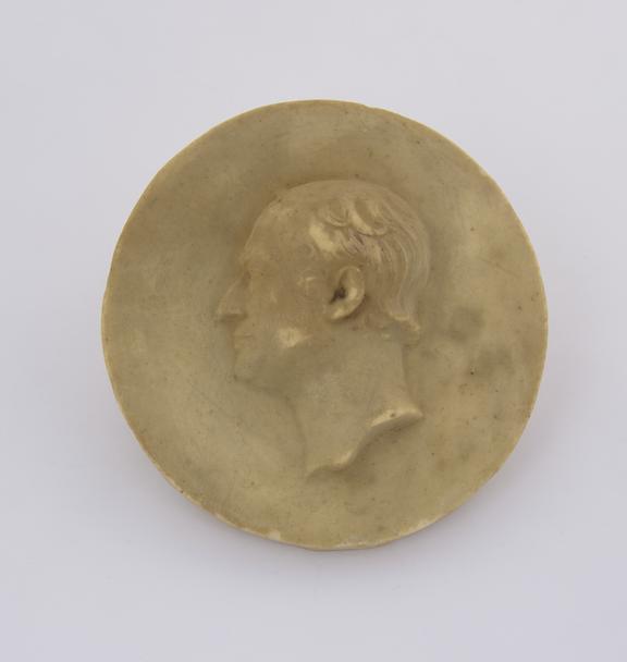 Compo. Cast, head of man facing L 3 1/2 dia'