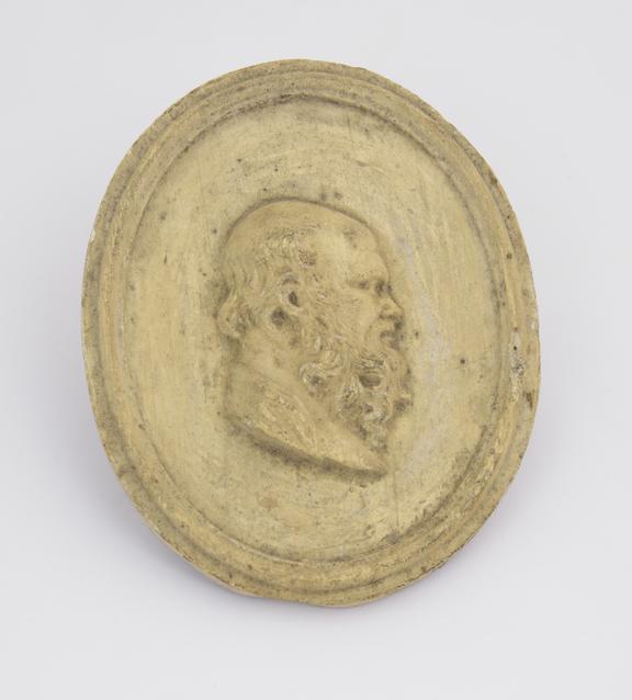 1 Reproduction in plaster, mans head with beard, facing R