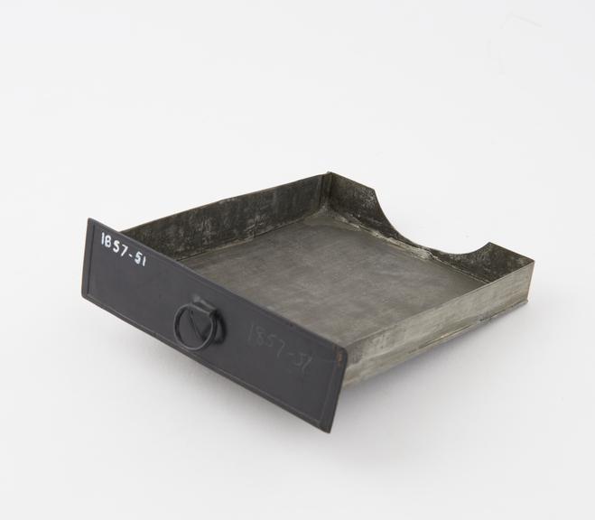 Black painted tinplated tray thought to be an oil catcher for