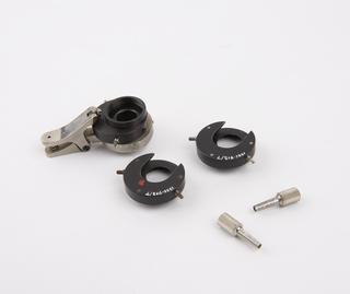 Three microscope objective changers