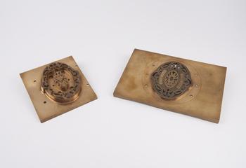 Two Indian revenue stamp dies, with mahogany case