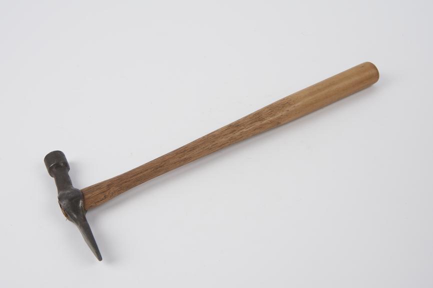 Saddler's hammer with a malacca handle.