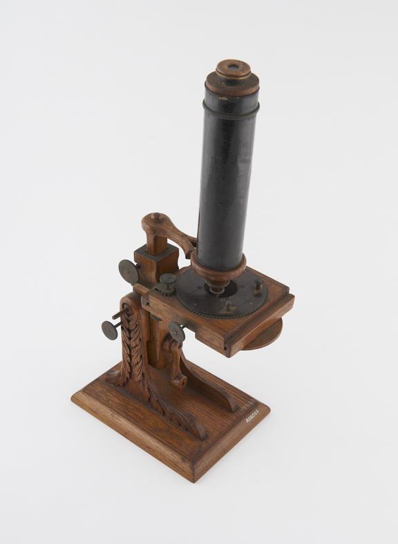 Compound monocular microscope with wooden stand