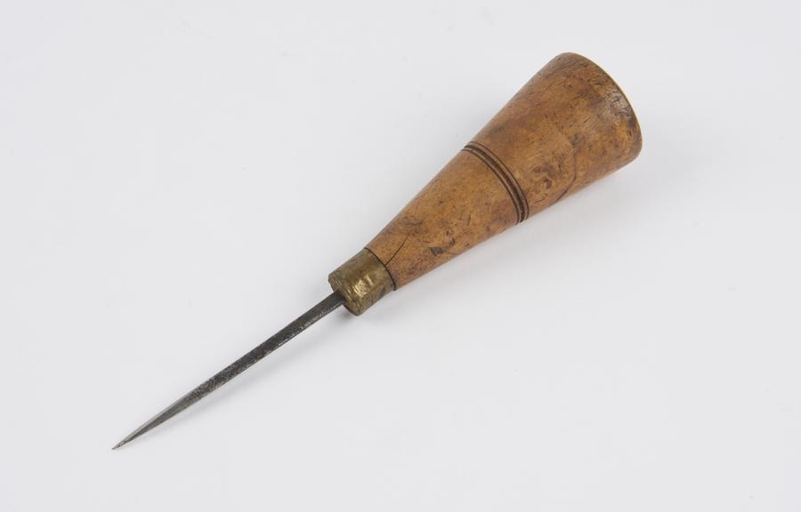 Saddler's large sewing awl with boxwood handle.