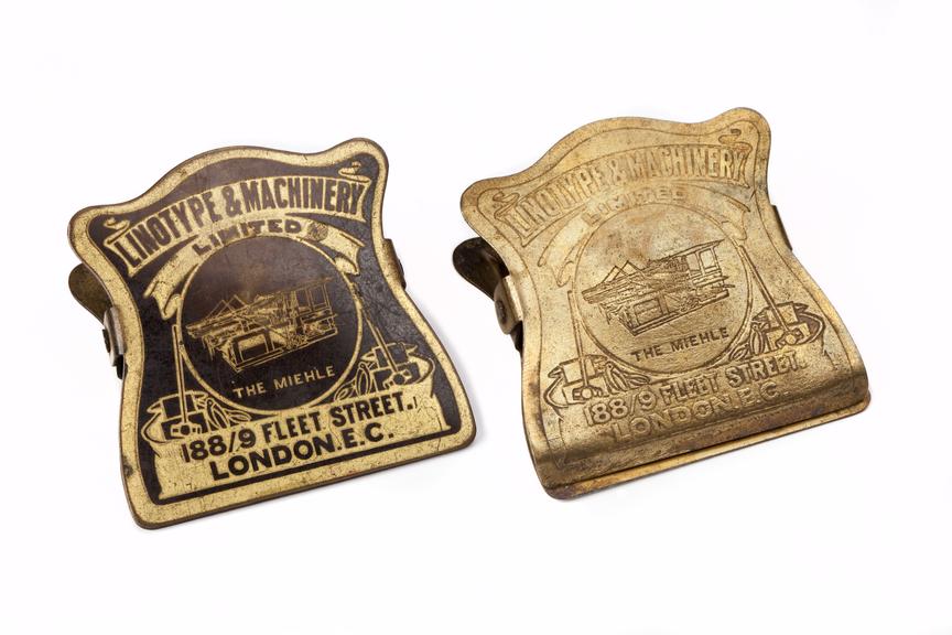 Two Miehle printing press nameplate bulldog clips made by