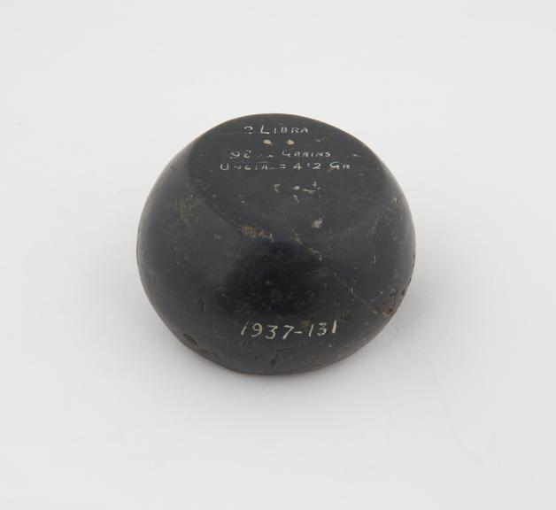 One of Eight Roman weights of black basalt, 1st century A.D