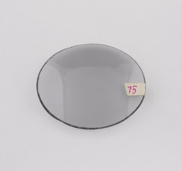 Oval smoke or neutral tint, bent glass spectacle lens