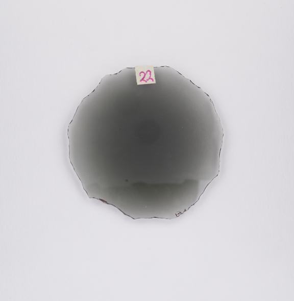 Round smoke double convex cataract lens.