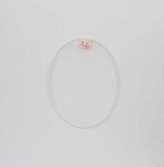 Oval white convex spectacle lens with bevelled edge for frame