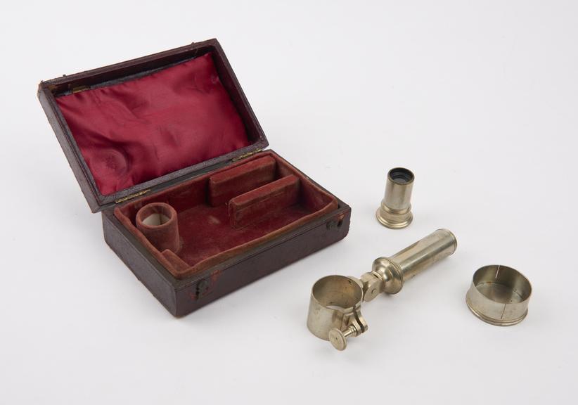 Red leather case containing stand fitting lid or screwing to