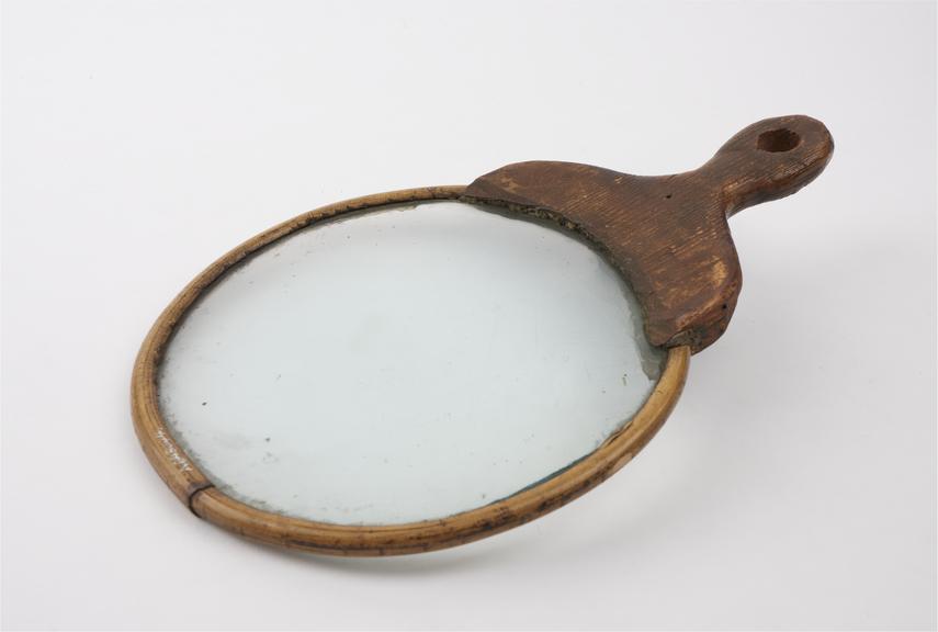 Crude hand lens in cane frame, 19th century, English