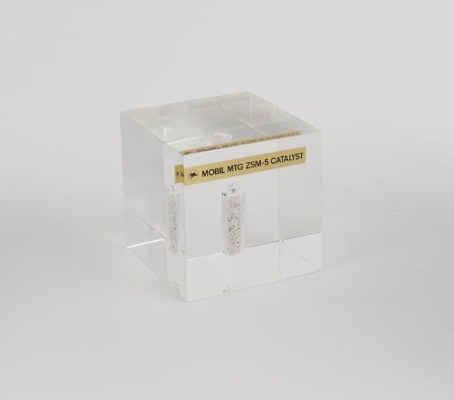 One 3 1/2 inch lucite cube containing a cylindrical vial of MTG