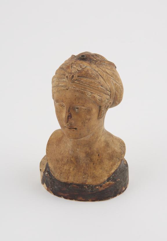 1 Plaster bust, Greek woman, hair in cap, with band round head