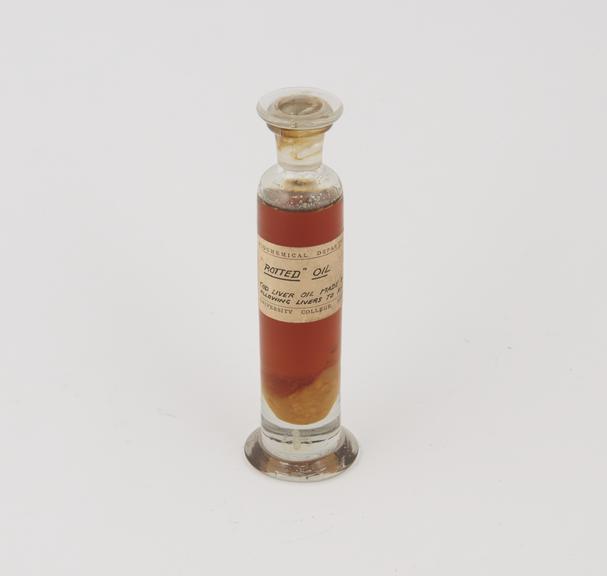 Specimen jar containing "rotted" cod liver oil made by Sir Jack Cecil Drummond, c.1920