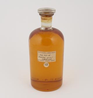 Jar of cod liver oil made by Sir Jack Cecil Drummond, c.1920.