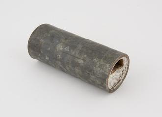 Sectioned pipe, almost completely blocked by hard water scale