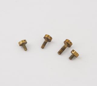Screws from triple bodied microscope attributed to C.D. Ahrens
