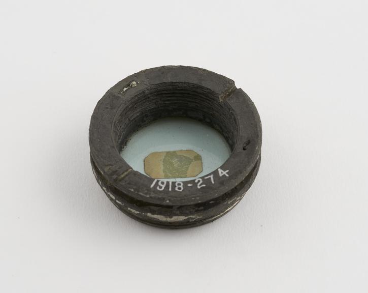 One of two old lenses, in lead mount