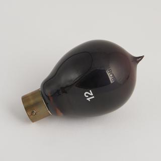 One of eighty-six early incandescent lamps. Probably single loop filament