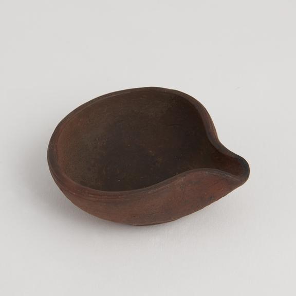 Red clay lipped dish, Kashmir, plain edge