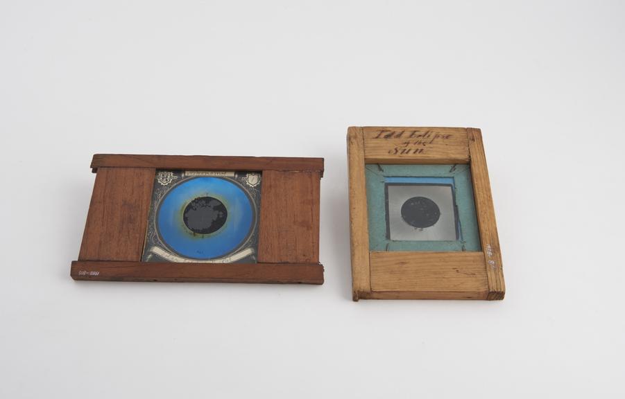 Two magic lantern slides showing total solar eclipse