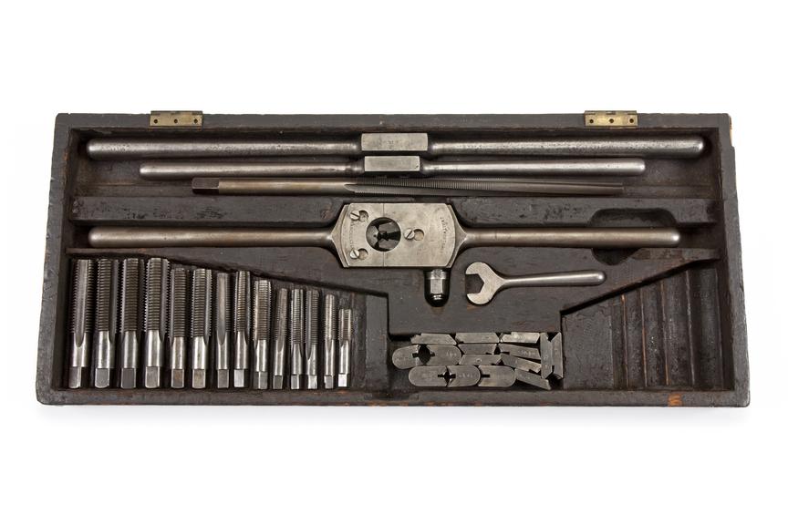 Box of taps, wrenches, die holder and cutters made by J