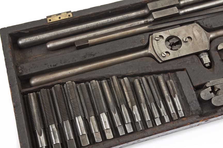 Box of taps, wrenches, die holder and cutters made by J
