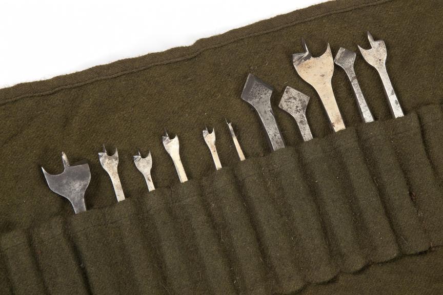 woodworking tool parts; roll of bits made from green cloth