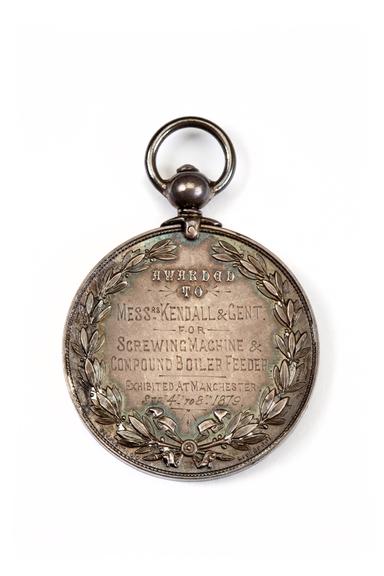 A medallion awarded to Kendall & Gent Limited by the Royal