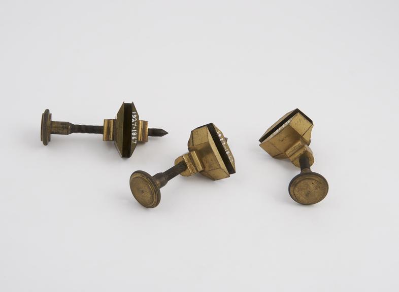 Three brass clamps with long adjusting screws for backboard of