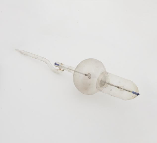 X-ray tube with adjustable glass shield for regulating hardness