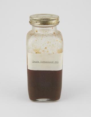 Specimen bottle containing cottonseed oil