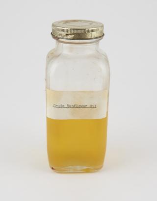 Specimen bottle containing sunflower seed oil