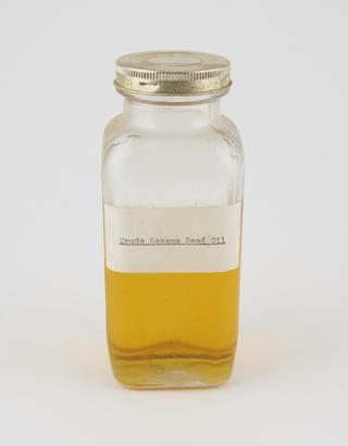Specimen bottle containing sesame seed oil
