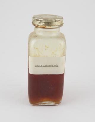 Specimen bottle containing linseed oil