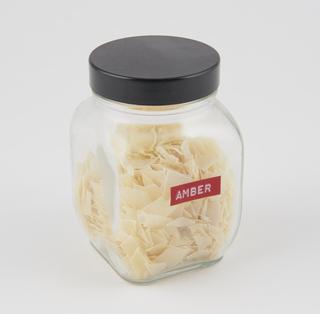 Jar of amber soap flakes