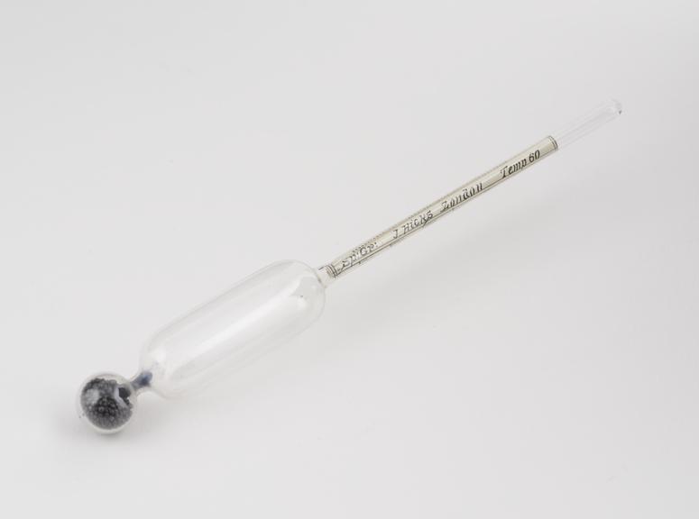 Glass hydrometer by J Hicks. Lead shot weight and paper scale