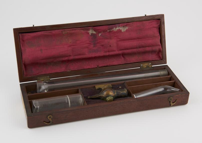 Glass acetometer by J Long. In mahogany box. Range 0 - 80.