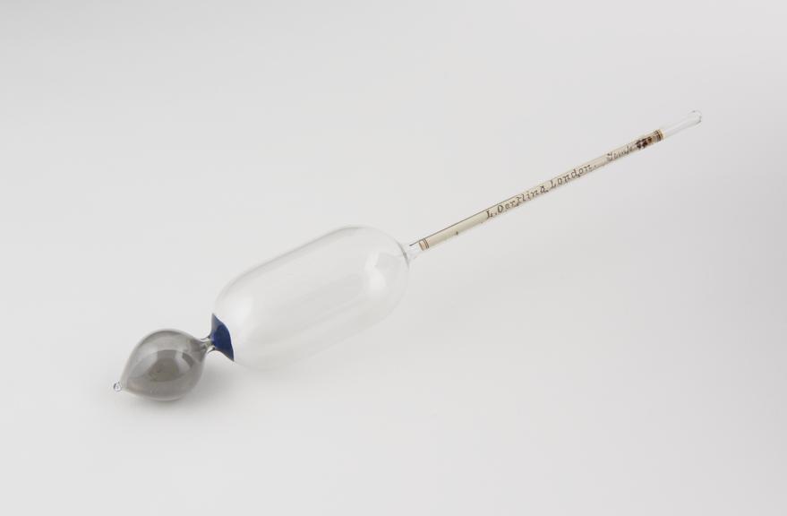 Glass hydrometer by Oertling. Mercury weight and paper scale