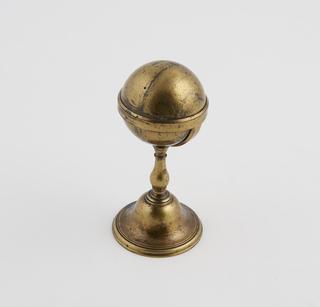 A Single Sphere Held in a Cup Stand.