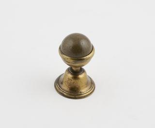 A Single Sphere Held in a Cup Stand.