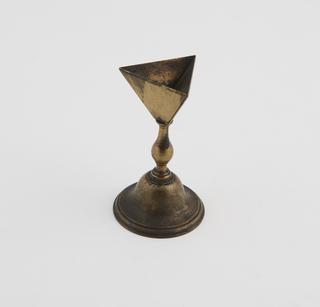 A Single Hollow Inverted Tetrahedron on a Stand.