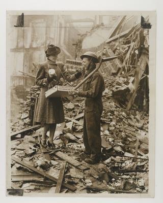 Soldier buys a Remembrance Day poppy during WWII